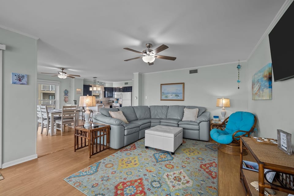 The design connects the living and dining areas
