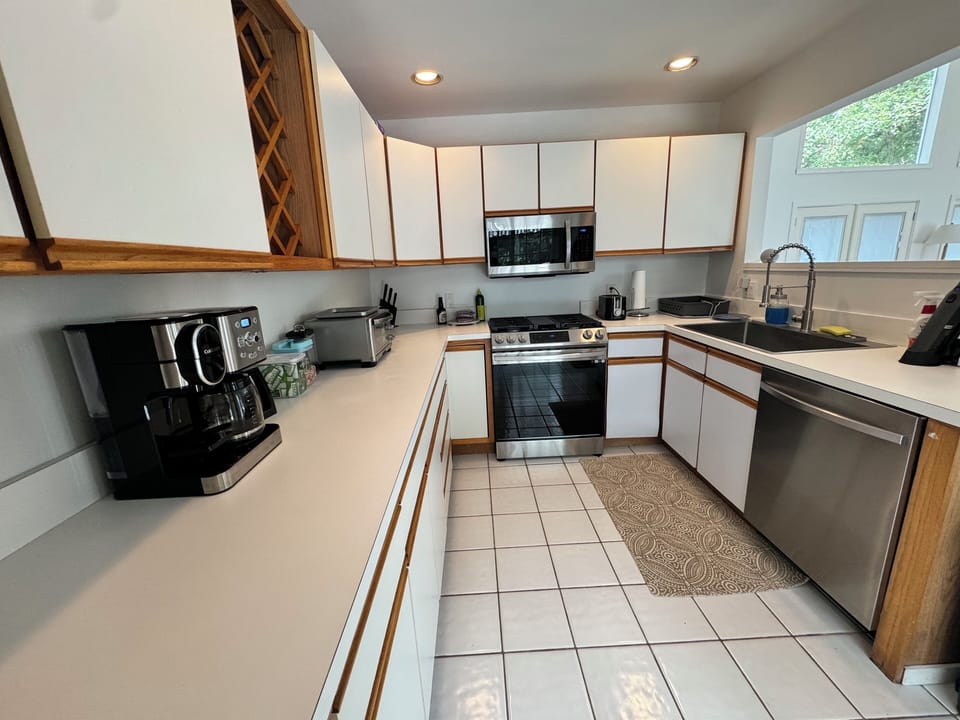 Fully equipped kitchen with new appliances and sink