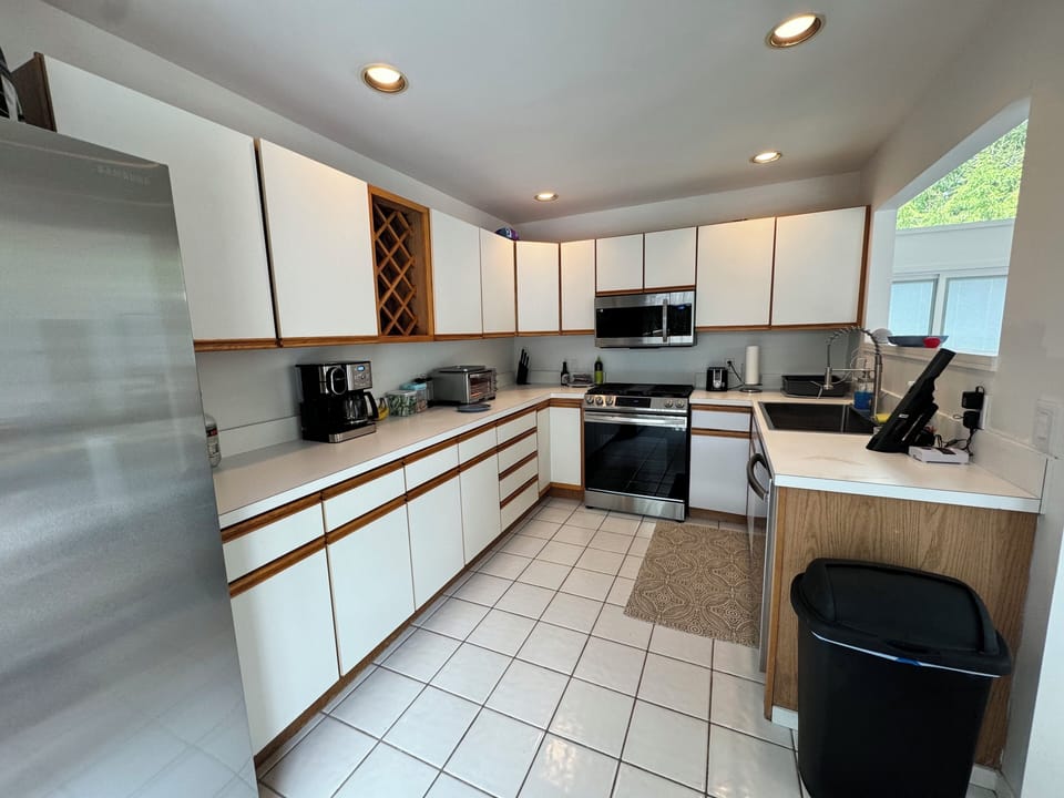 Fully equipped kitchen with new appliances and sink