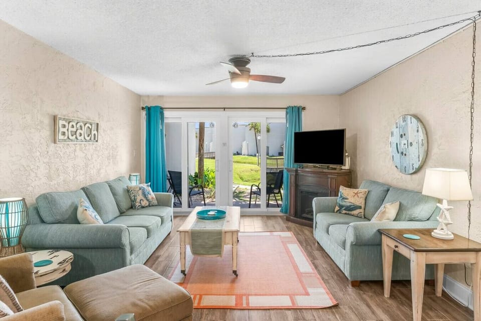 Cozy Living Room with Sleeper Sofa, Flat Screen TV and Private Patio Access