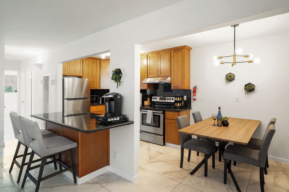 Family Apartment, 2 Bedrooms, Patio | Private kitchen | Coffee/tea maker, dining tables