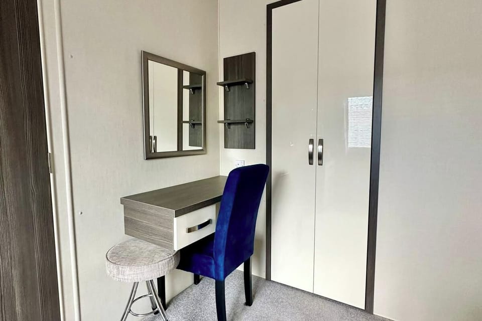 Master Bedroom, vanity unit and wardrobe.
Hairdryer in drawer.