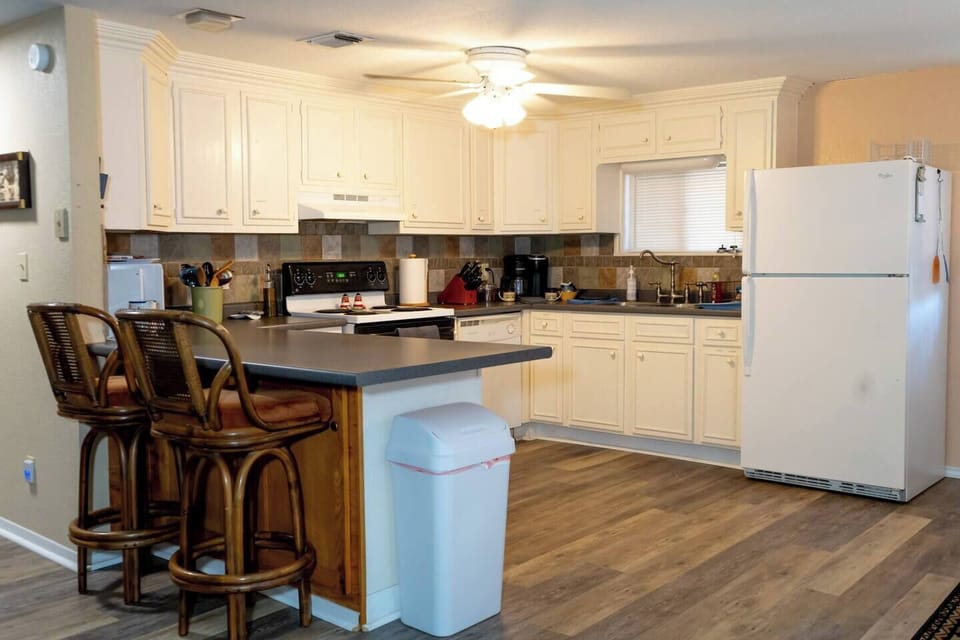 Fully equipped kitchen with stainless steel appliances.