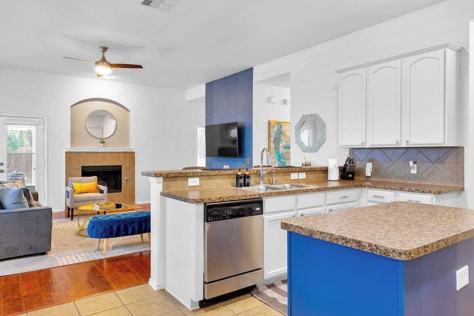 Fully stocked kitchen with pots, kitchen necessities, cooking spices, coffee bar and more. 