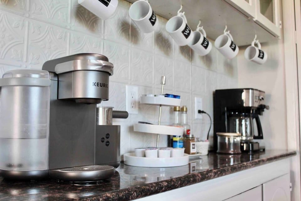 Start your day with a fresh cup of coffee brewed in this Keurig coffee maker in our spacious kitchen, where everyone can gather and cook meals together