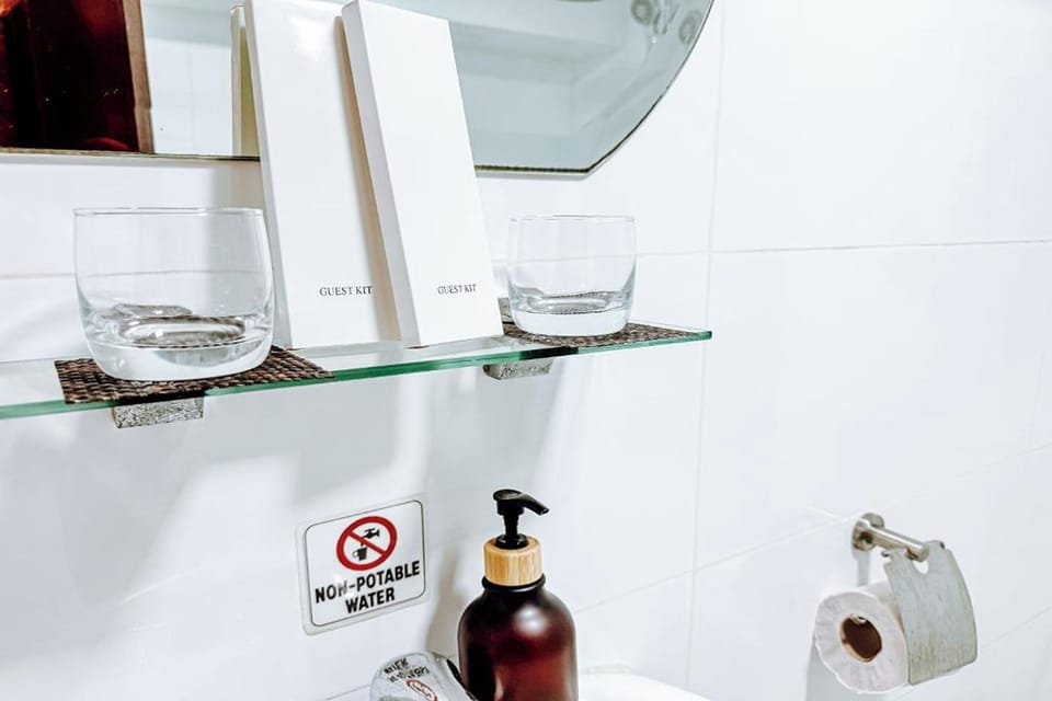 Shower, rainfall showerhead, bidet, towels