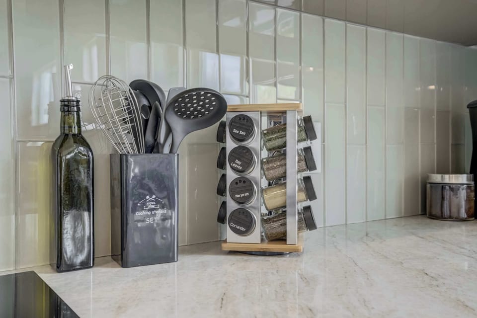 Fully stocked spice rack and kitchen essentials, making it easy to prepare your favorite meals with all the right flavors. Cook like a pro during your stay.

