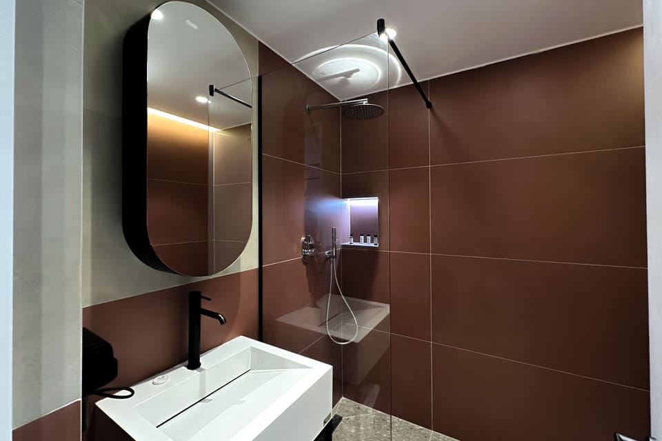 Rainfall showerhead, hair dryer, slippers, towels