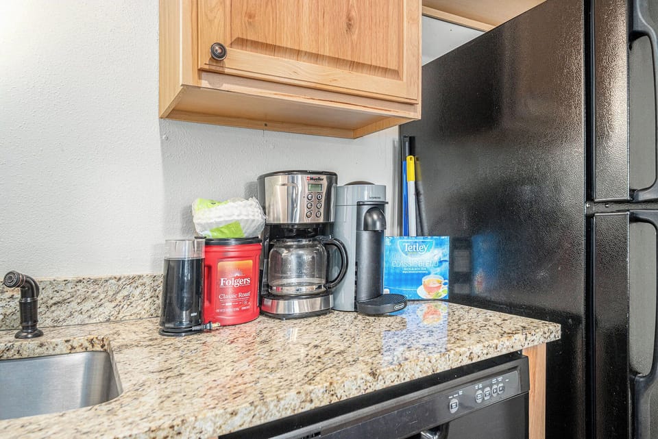 - Morning perks include both drip and Keurig style coffee makers for convenience
- Granite counter coffee corner stocked with mugs and essentials for your stay
- Everything you need for a relaxing caffeine fix before your mountain adventures