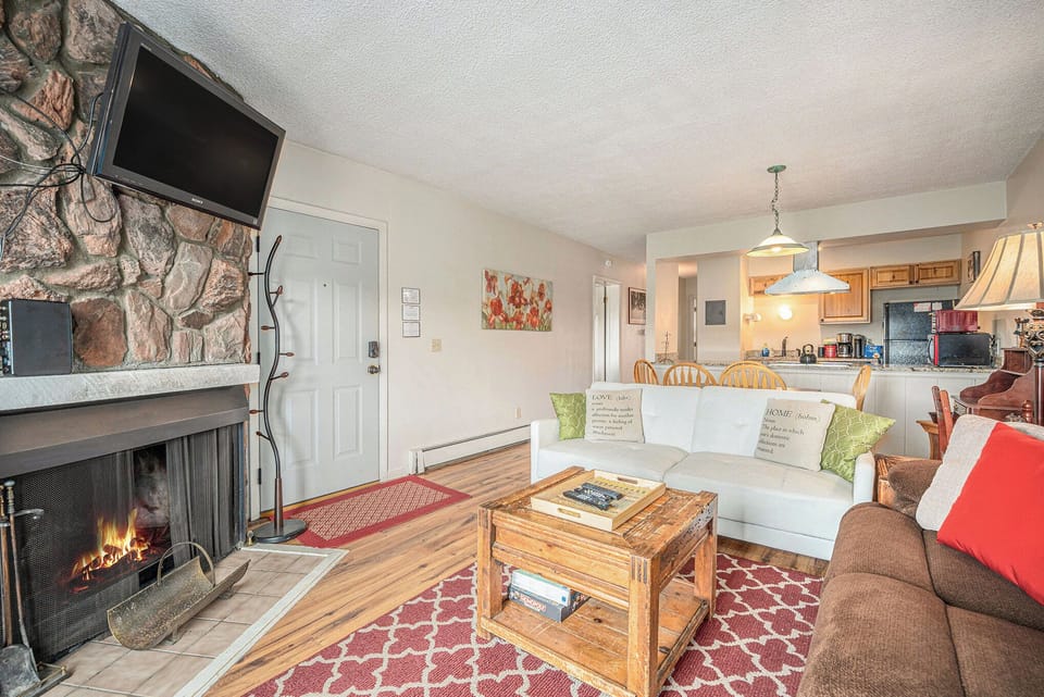 - Bright and cheerful living area with fireplace and open layout design
- Classic lodge décor with pops of color adds warmth and personality
- Seamless flow from front door to kitchen and dining makes hosting a breeze