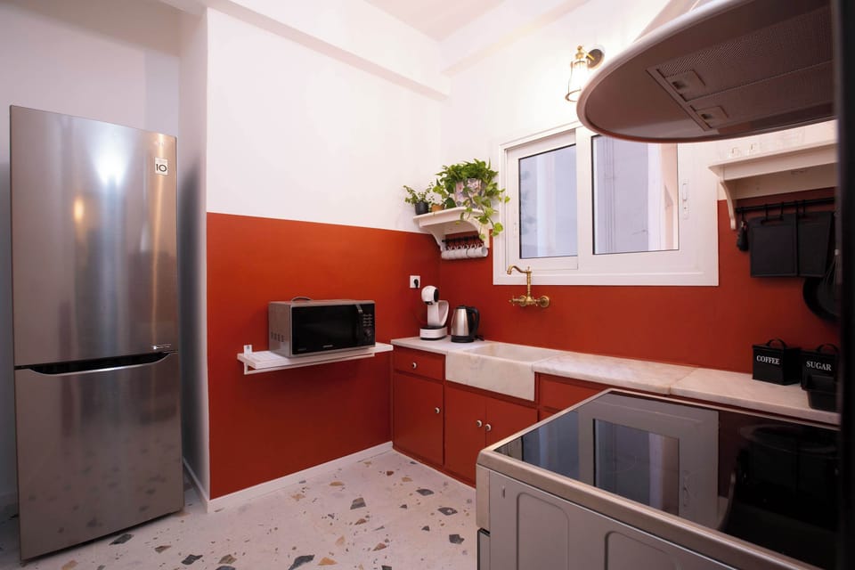 Warm-toned kitchen featuring modern appliances and generous counter space, perfect for easy meal preparation and enjoyable cooking.
