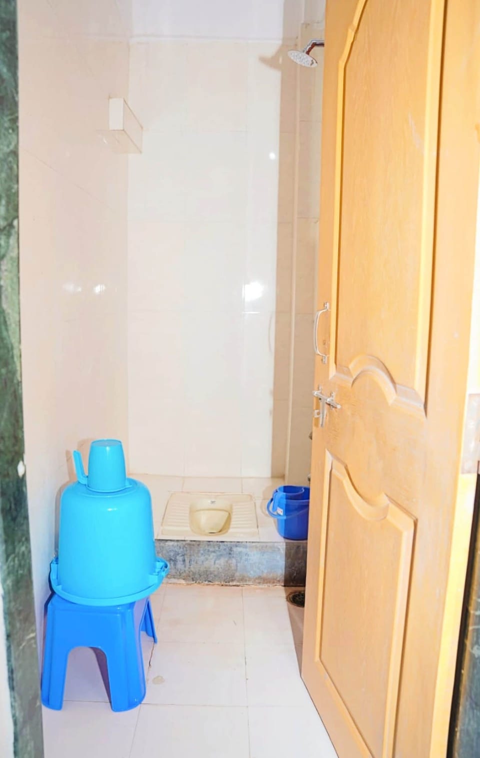 Shower, rainfall showerhead, slippers, towels