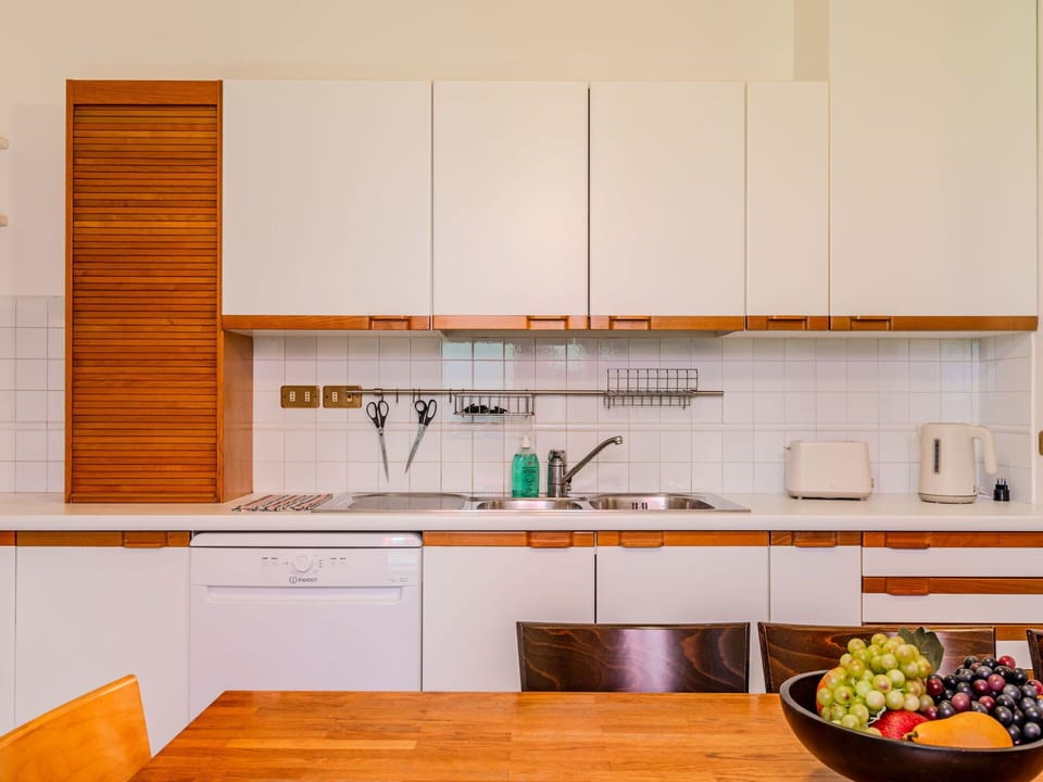 Kitchen, Countertop, Interior Design, Flooring, Wood, Cabinetry, Kitchen Appliance, Furniture, Floor, Major Appliance