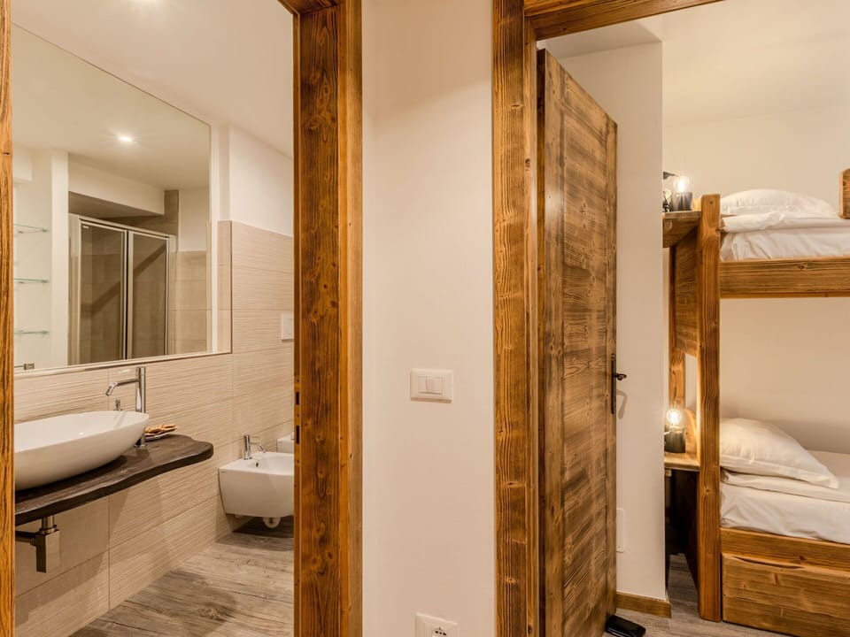 Wood, Interior Design, Furniture, Flooring, Ceiling, Floor, Bedroom, Lighting, Room, Bed