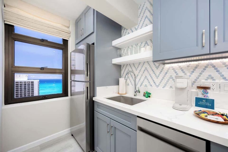 Full-equipped kitchen with a view of the ocean from the window