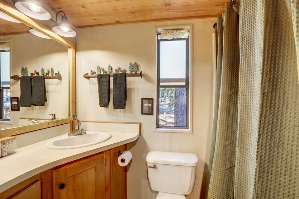 The bathroom features a full tub and shower—perfect for rinsing off after a day on the trails or soaking in a relaxing bath.