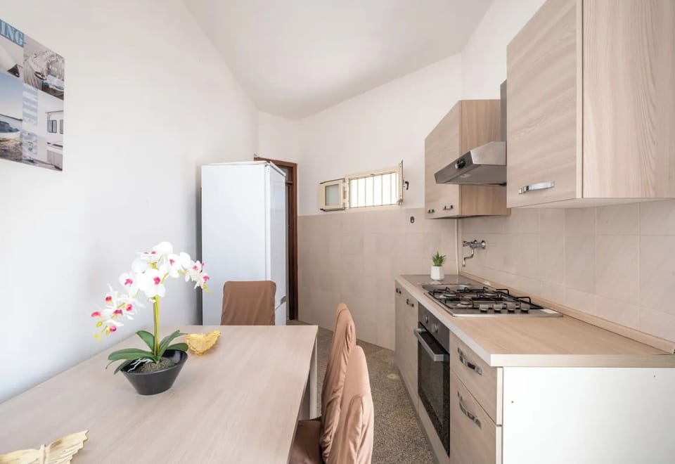 House | Private kitchen | Fridge, stovetop, cookware/dishes/utensils, dining tables
