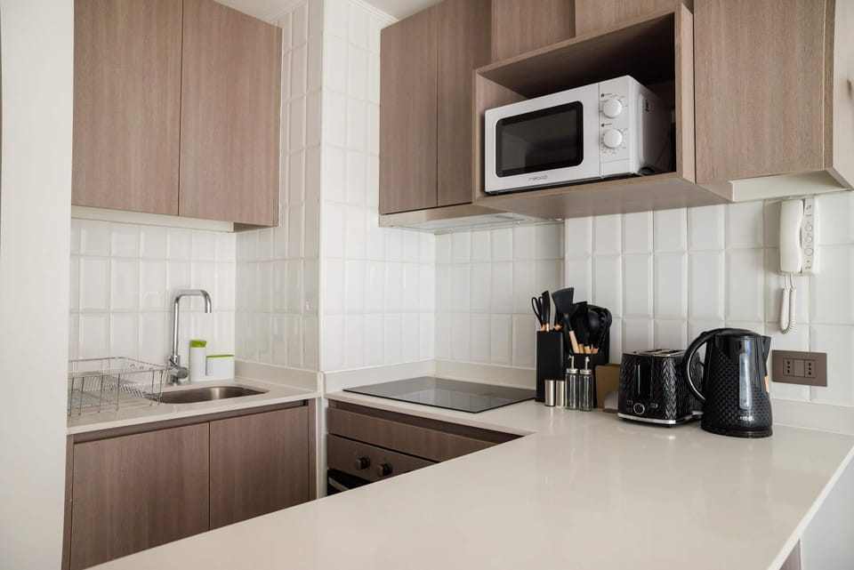 Modern and efficient kitchen with all essentials for a cozy meal at home.