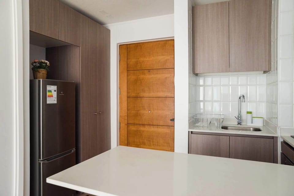 Sleek and modern kitchen with ample storage and natural light, perfect for culinary adventures.