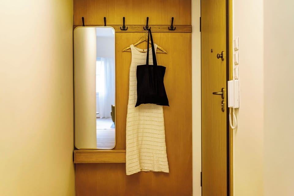 An entry area with hooks and a mirror keeps your essentials organized.
