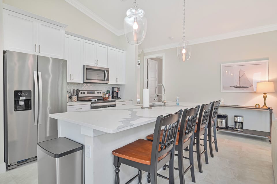 Coconut Point Oasis - Fully equipped kitchen with island seating