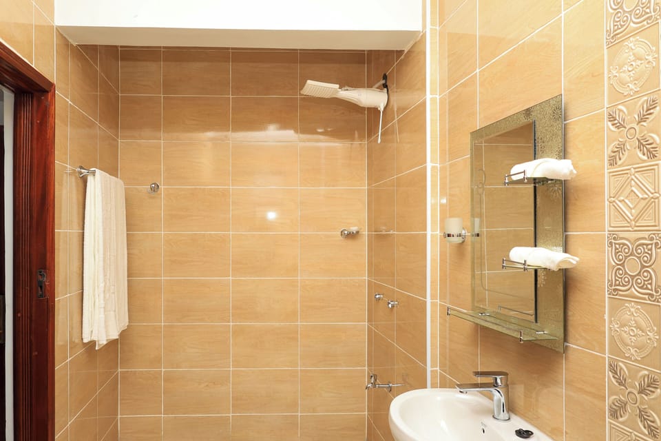 Standard Single Room, Balcony | Bathroom | Shower, bathrobes, slippers, towels