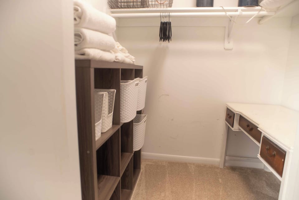 large walk in closet in primary bedroom
