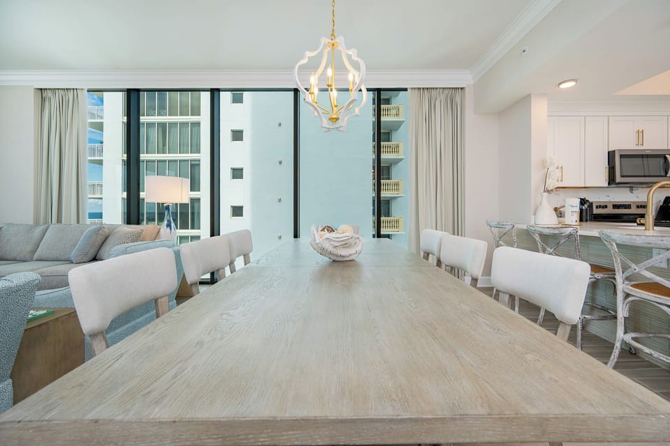 Dine in style at the spacious table with stunning beachfront views for memorable meals with loved ones