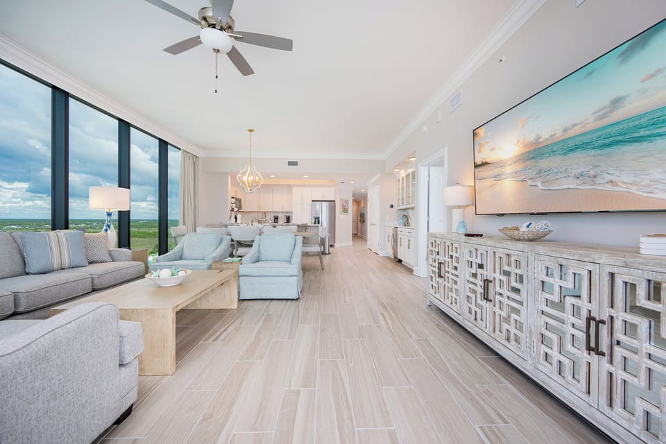 Unwind in the inviting living space with cozy seating and a large TV, perfect for relaxation and entertainment