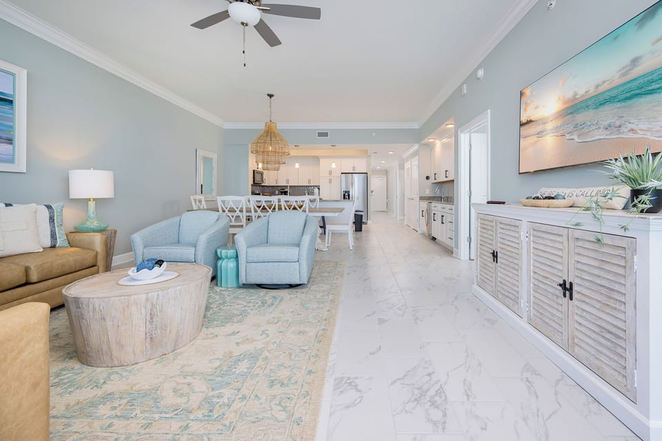 Relax in this inviting living space with comfortable seating, stylish decor, and a large TV