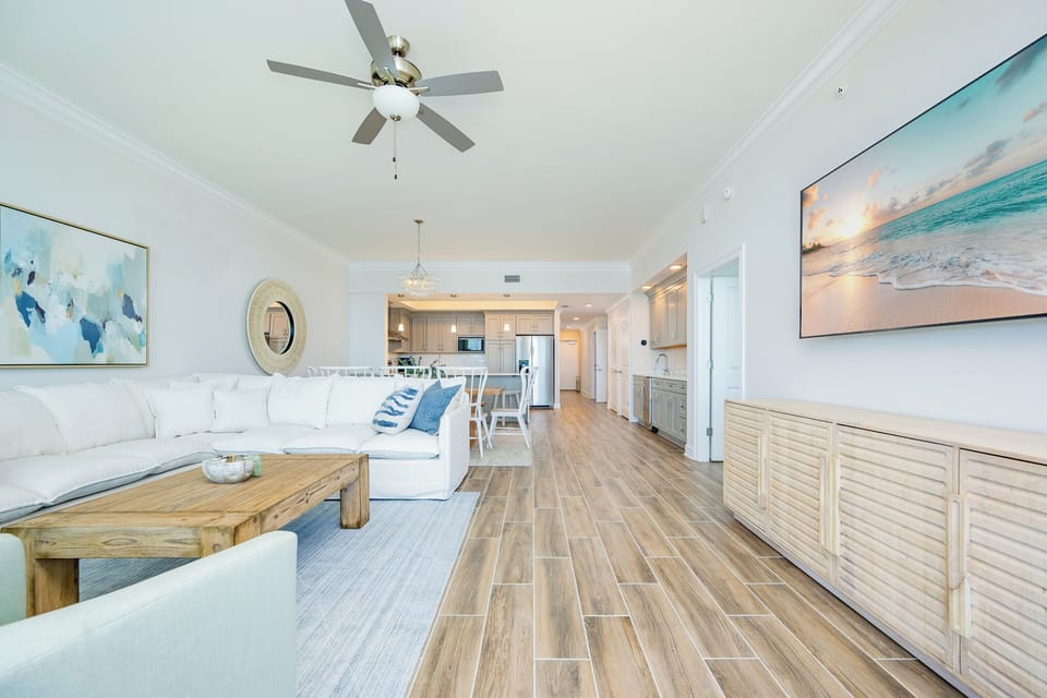Relax on the spacious sectional sofa, with a stylish TV and inviting decor creating a welcoming coastal vibe