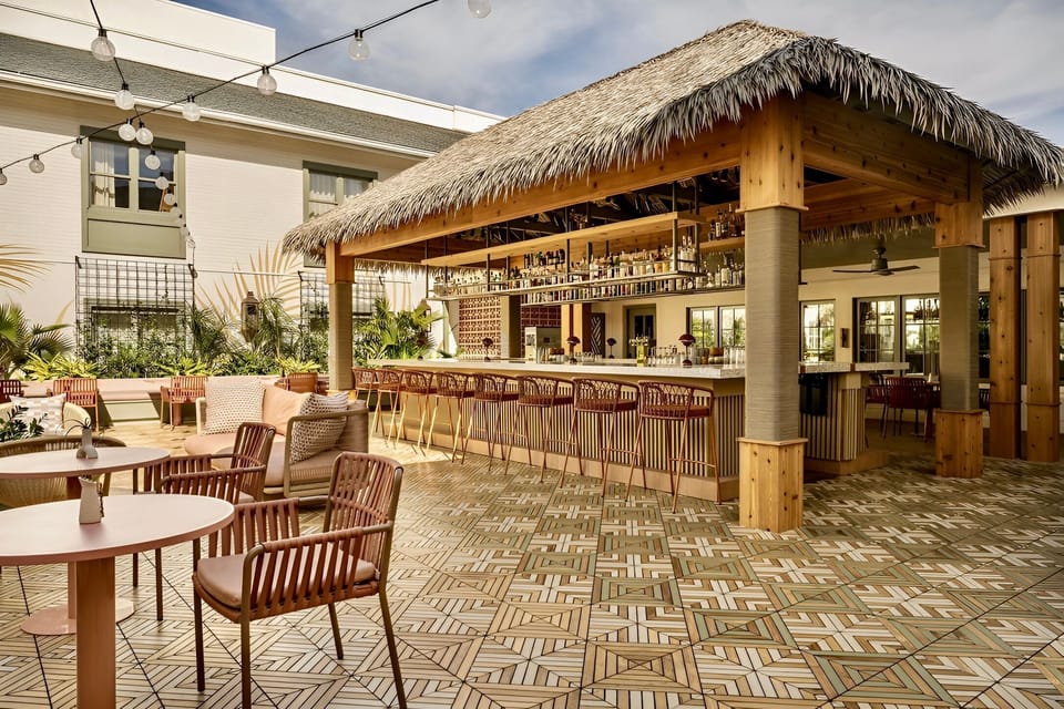 Gather under the thatched roof for easygoing moments, where every seat invites laughter and stories shared.