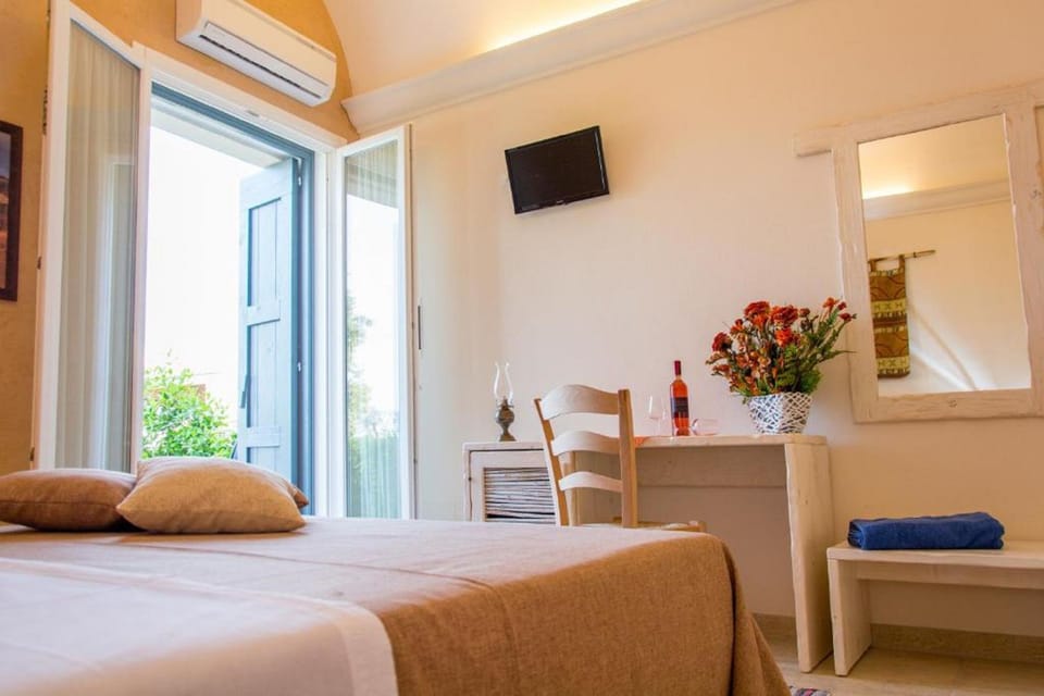 Triple Room | Free minibar items, in-room safe, desk, cribs/infant beds