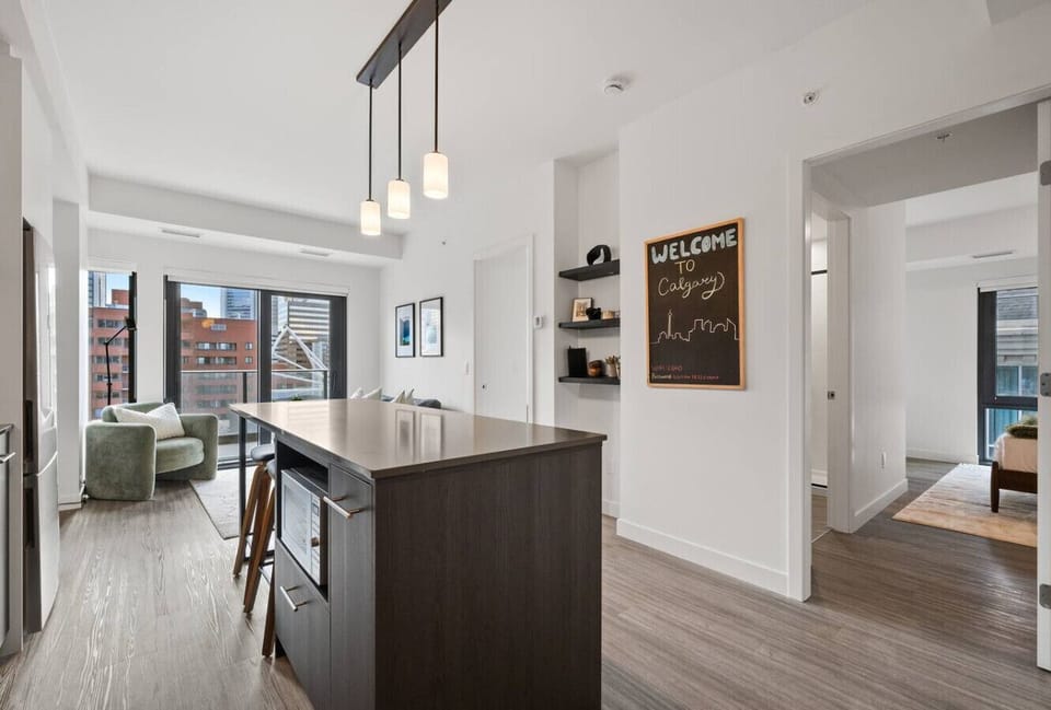 Full kitchen with a drip coffee maker, ground coffee, tea & sugar.