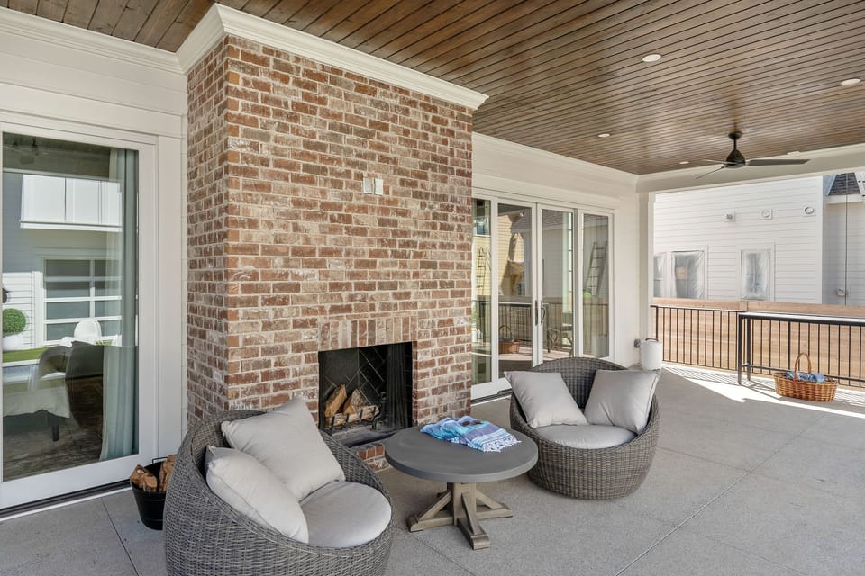 relax around the fireplace with a pool view