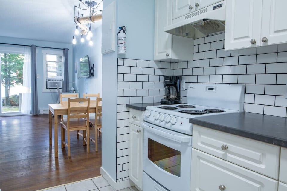 Fully equipped kitchen for easy meal prep. Dining table for four.