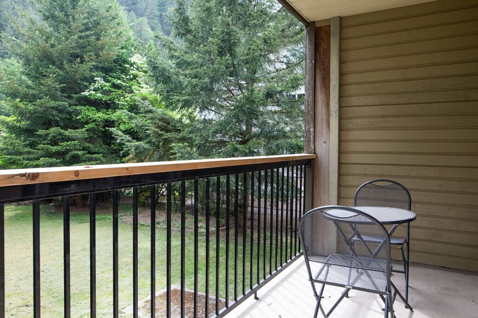 Private balcony with peaceful green views.