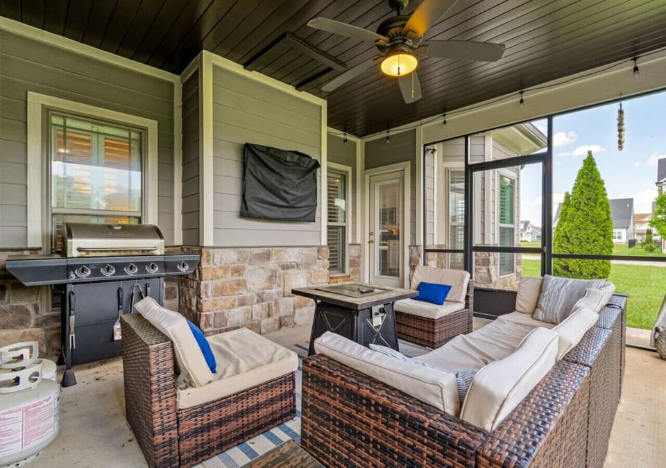 Hang out in the screened in area while grilling and watching your favorite game or show around the fire pit
