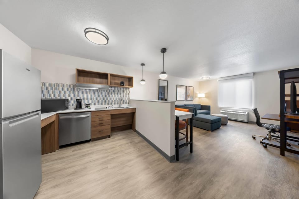 Suite, 1 King Bed, Accessible, Non Smoking | Desk, laptop workspace, blackout drapes, iron/ironing board