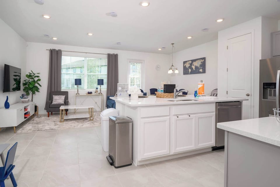 The open living/kitchen/dining area offers ample space to stretch out & relax