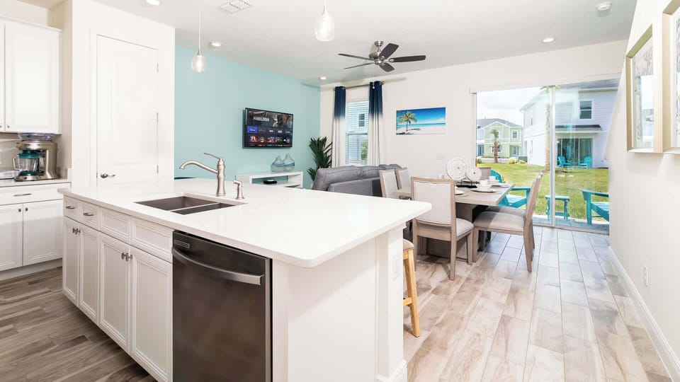 The gleaming countertop offers additional seating for 4