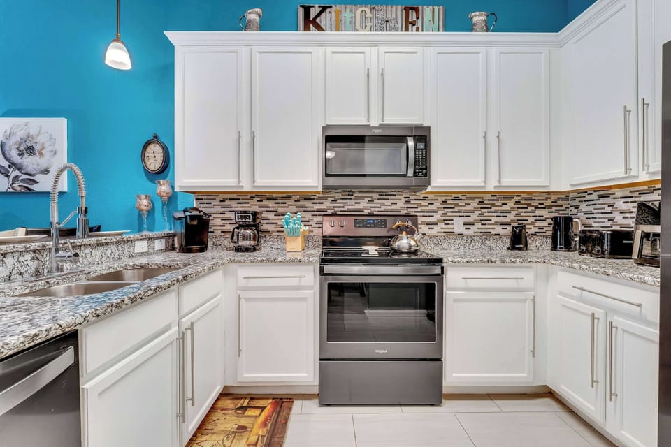 The open, airy kitchen offers ample space & all the comforts of home