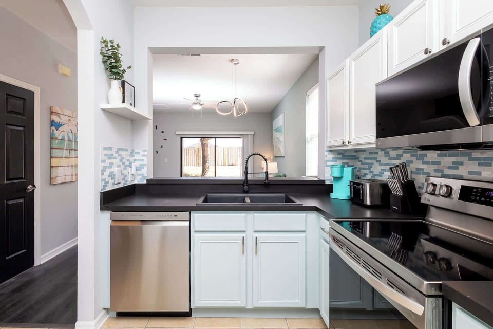 The open, airy kitchen offers ample space & all the comforts of home