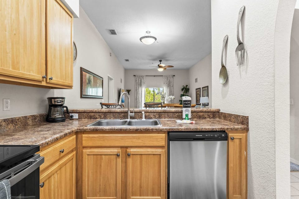 The cozy kitchen offers ample space & all the comforts of home