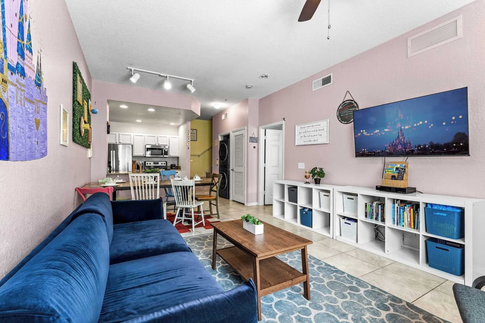 Cozy and spacious living area with, ceiling fan & smart TV
