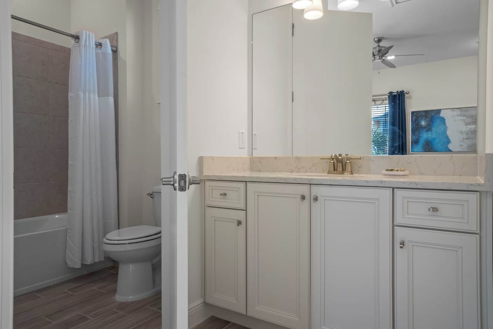 Bathroom 2 with bath tub shower combo en suite to bedroom 2