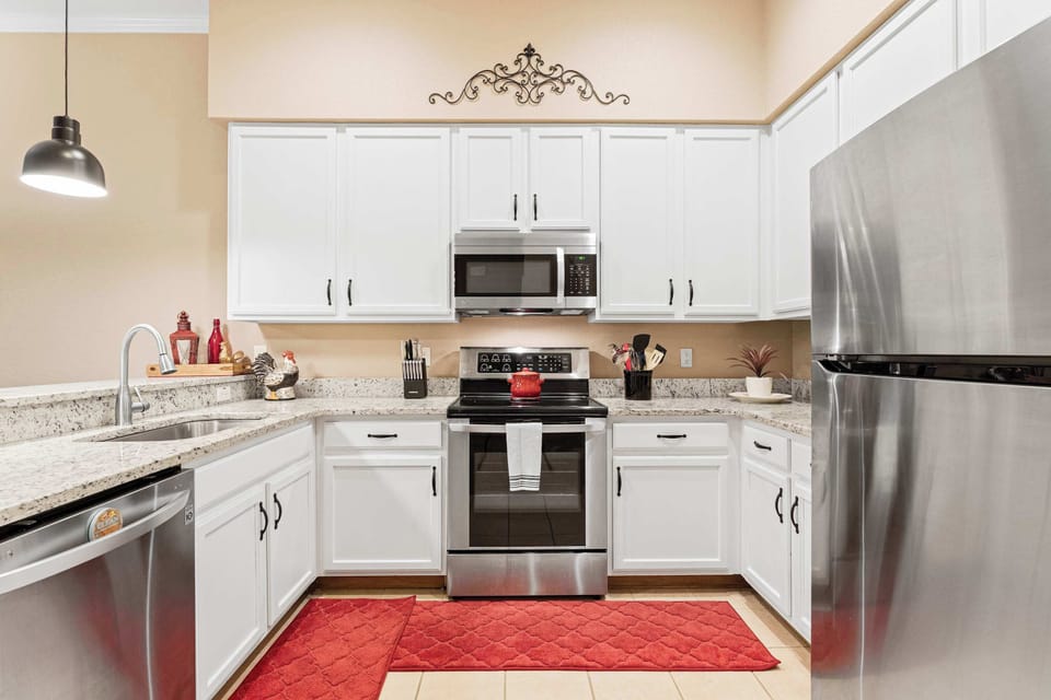 The open, airy kitchen offers ample space & every home comfort
