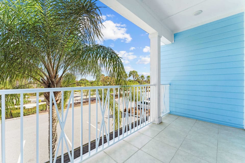 Step onto the 2nd-level balcony & enjoy the fresh air & palm trees