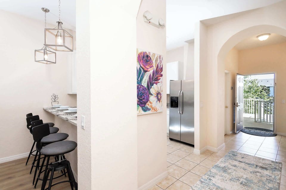 The breezy, open kitchen offers ample space & all the comforts of home