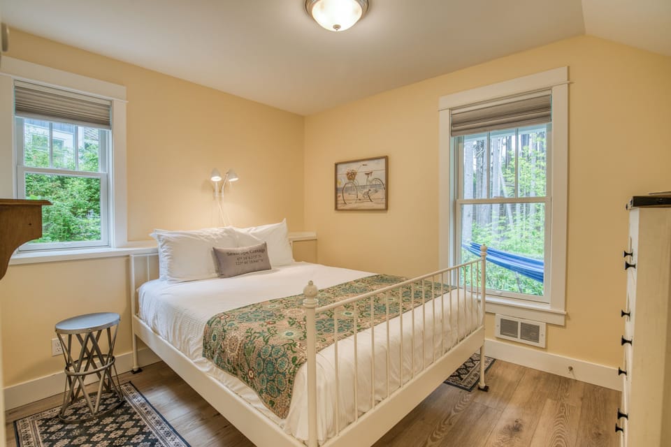 The second bedroom is located on the lower level of the home with a queen bed. 